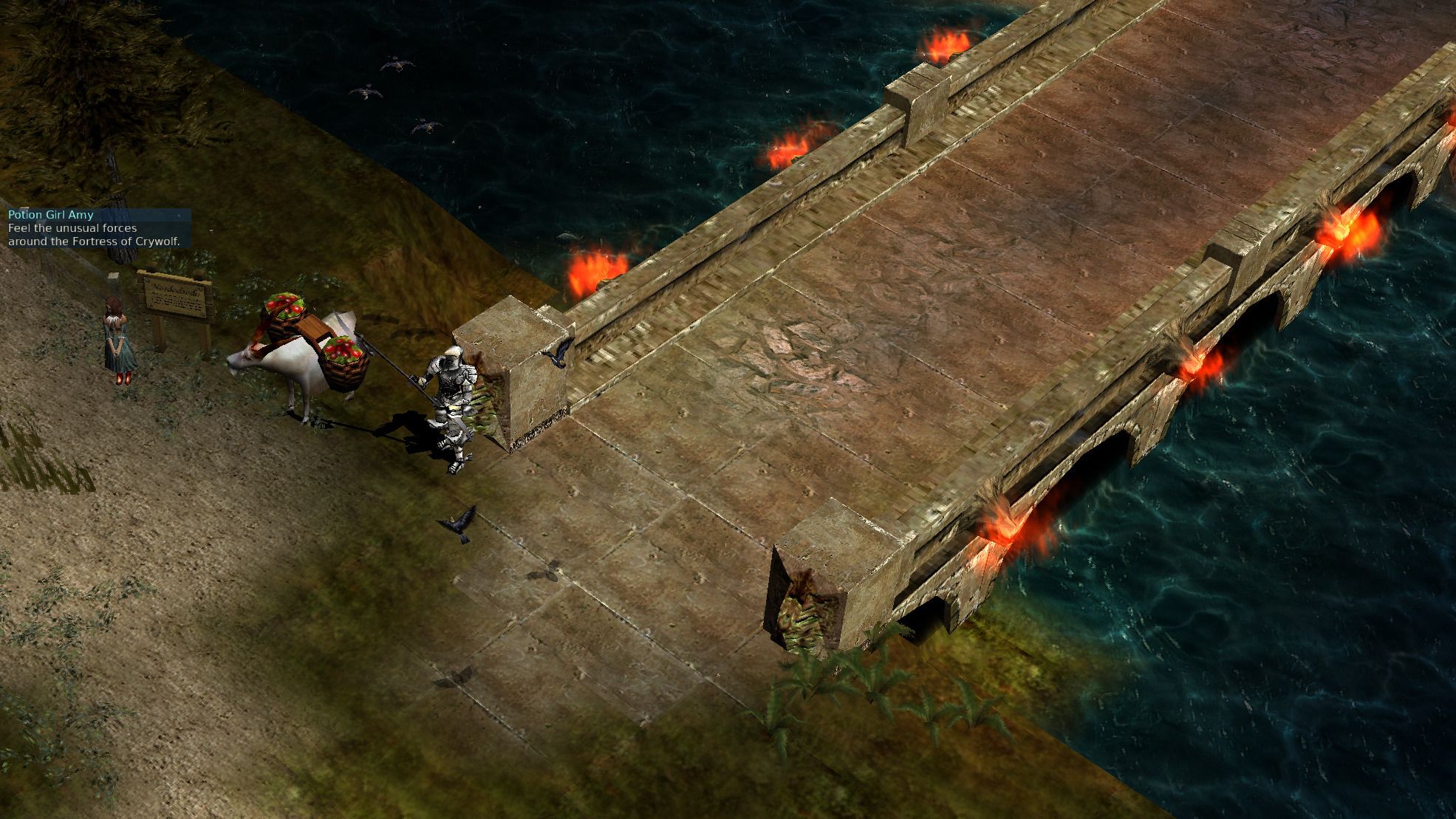 Players crossing the torch-lit bridge into Lorencia.